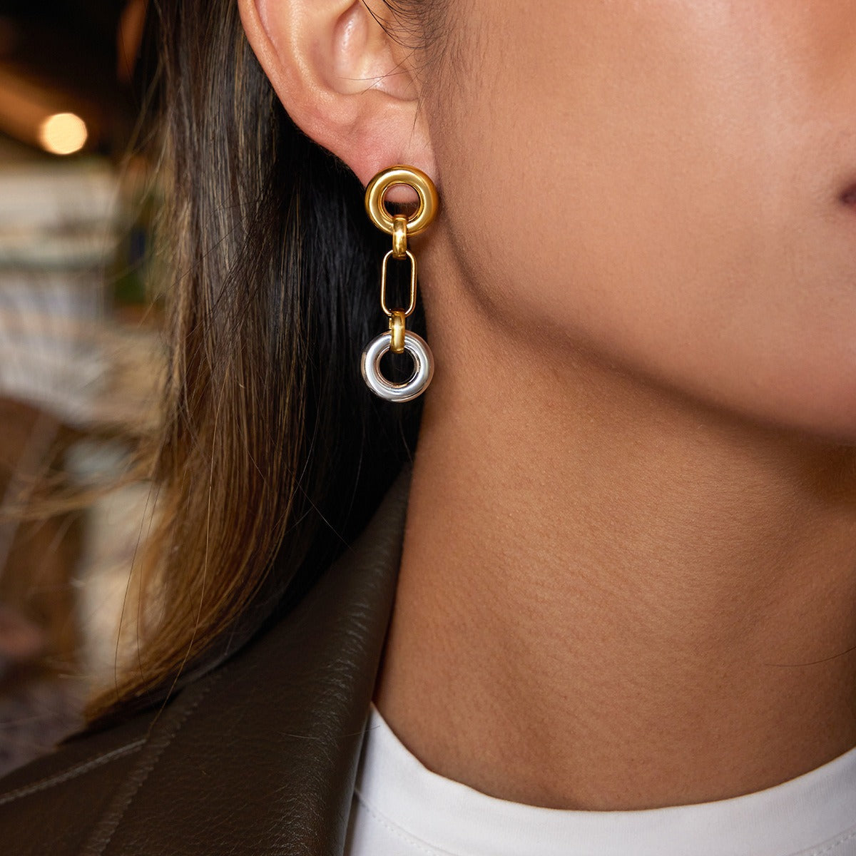 18K gold hoop earrings, a luxurious and sophisticated pair of stud earrings.