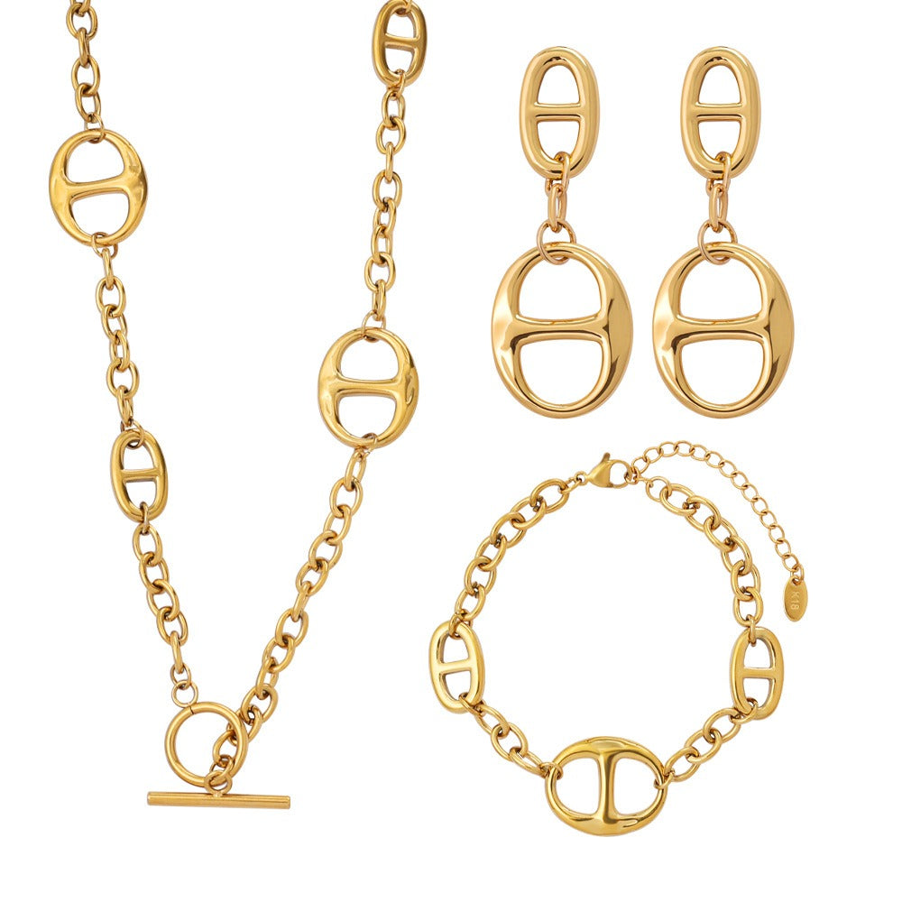 18K gold geometric-shaped necklace, bracelet, and earrings set.